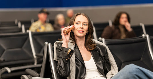 Peach Wand being used by a woman at the airport